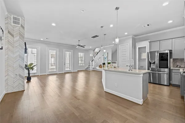 a view of a living room and kitchen with a large window