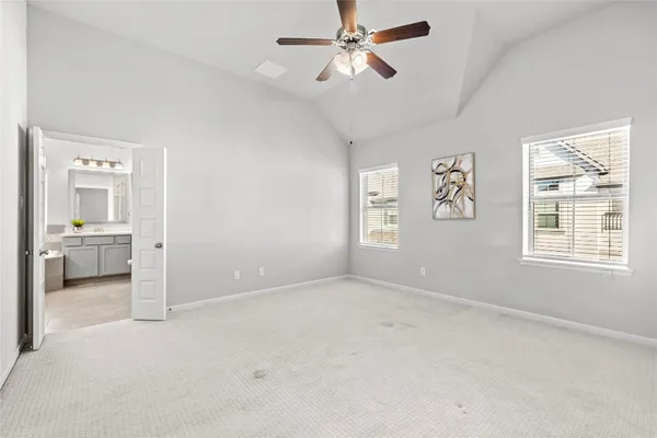 a view of a livingroom with a ceiling fan and window