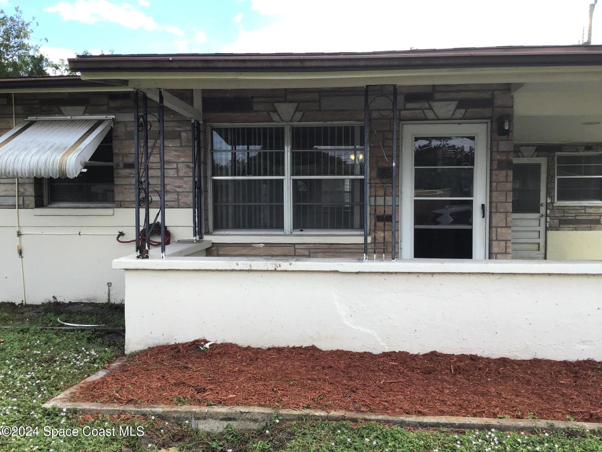 2197 King Richard Road Melbourne, FL 32935 - Photo 1 of 12 a view of house with a front door