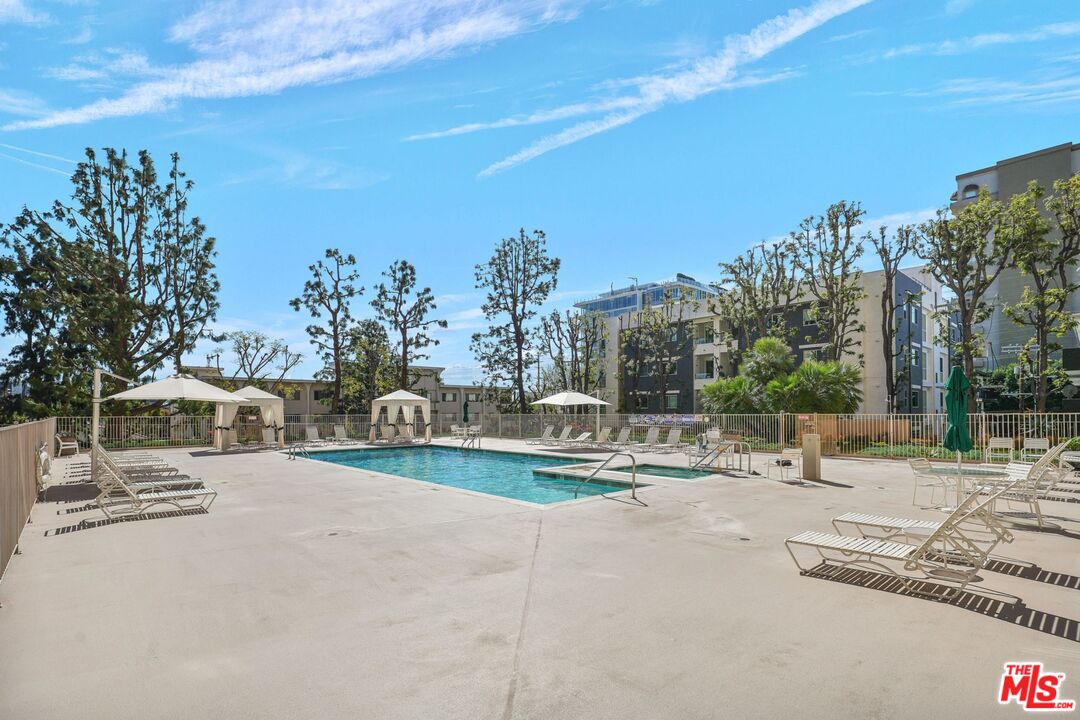 100 South Doheny Drive, Unit 506 Los Angeles, CA 90048 - Photo 13 of 17 a view of outdoor space with seating area and trees around