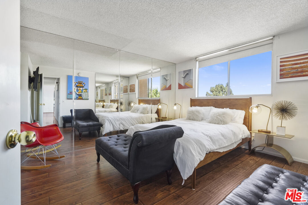 100 South Doheny Drive, Unit 506 Los Angeles, CA 90048 - Photo 8 of 17 a bedroom with a bed and window