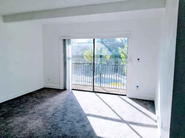 a view of a room with a large window