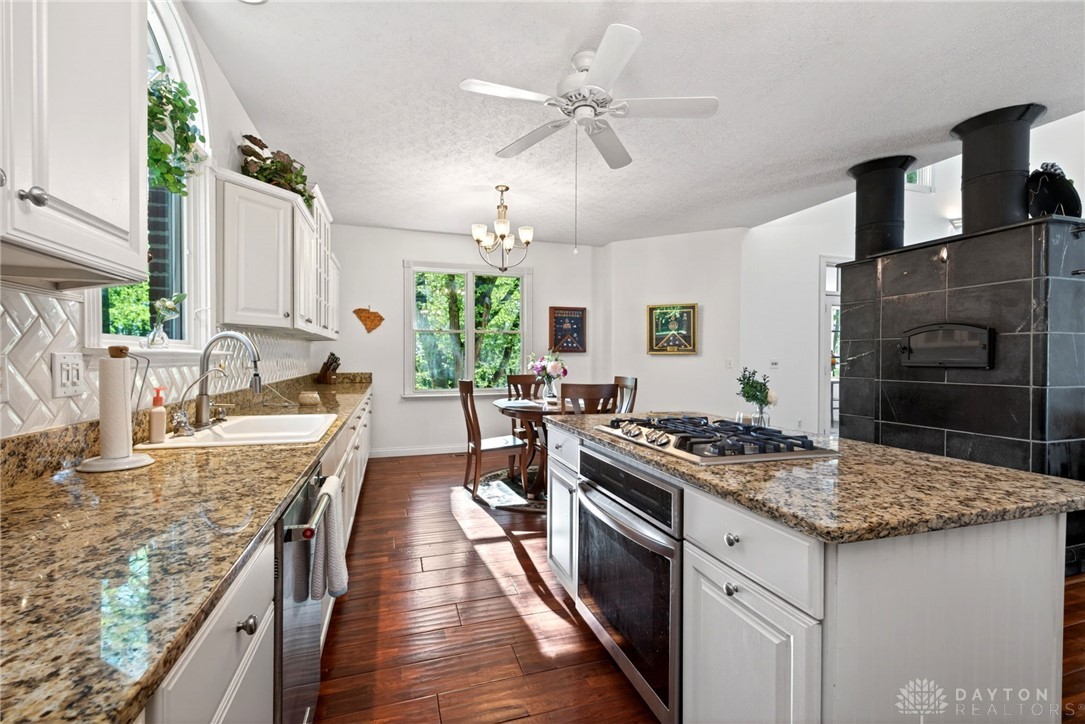 330 South Alpha Bellbrook Road Bellbrook, OH 45305 - Photo 18 of 87 This spacious kitchen features ample counter space, a central island, and abundant natural light.