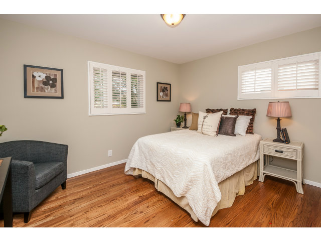 251 Marcella Way Millbrae, CA 94030 - Photo 8 of 14 a bedroom with a bed and wooden floor