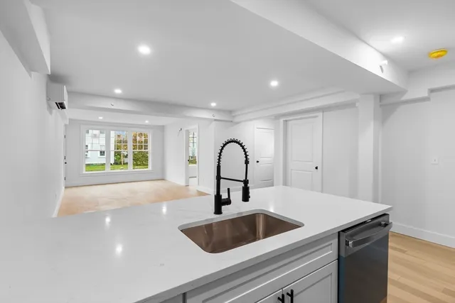 a kitchen with a sink and a large window
