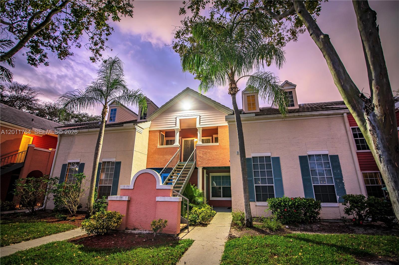1011 Crystal Way, Unit D Delray Beach, FL 33444 - Photo 1 of 9 a front view of a house with yard and green space
