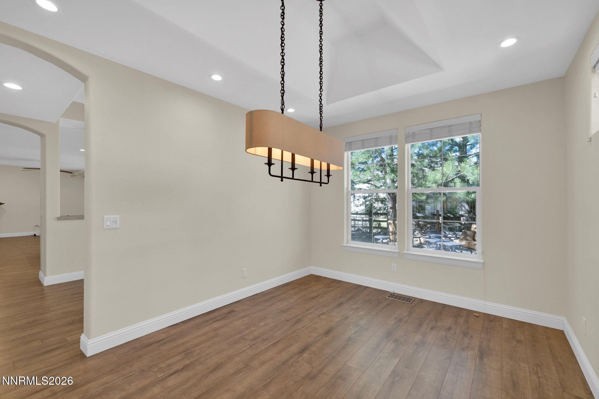4885 Buckhaven Road Reno, NV 89519 - Photo 17 of 58 a view of an empty room with wooden floor and a window