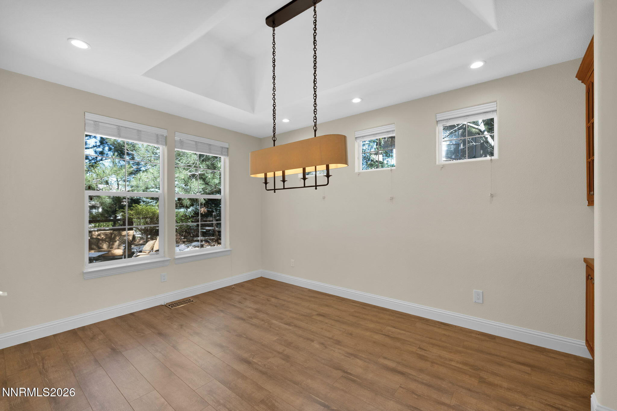 4885 Buckhaven Road Reno, NV 89519 - Photo 18 of 58 a view of an empty room with wooden floor and a window