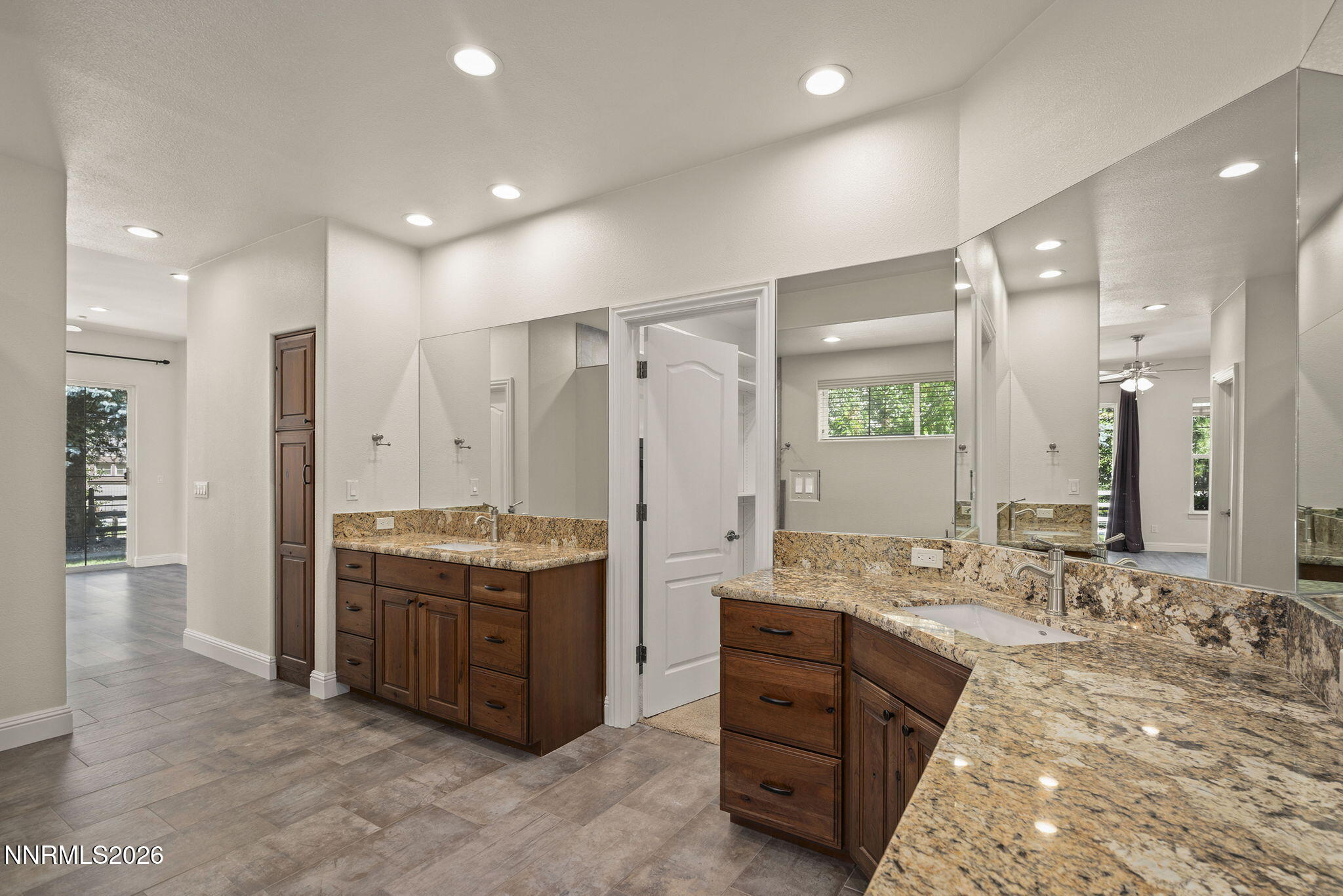 4885 Buckhaven Road Reno, NV 89519 - Photo 29 of 58 a bathroom with a granite countertop sink mirror and shower