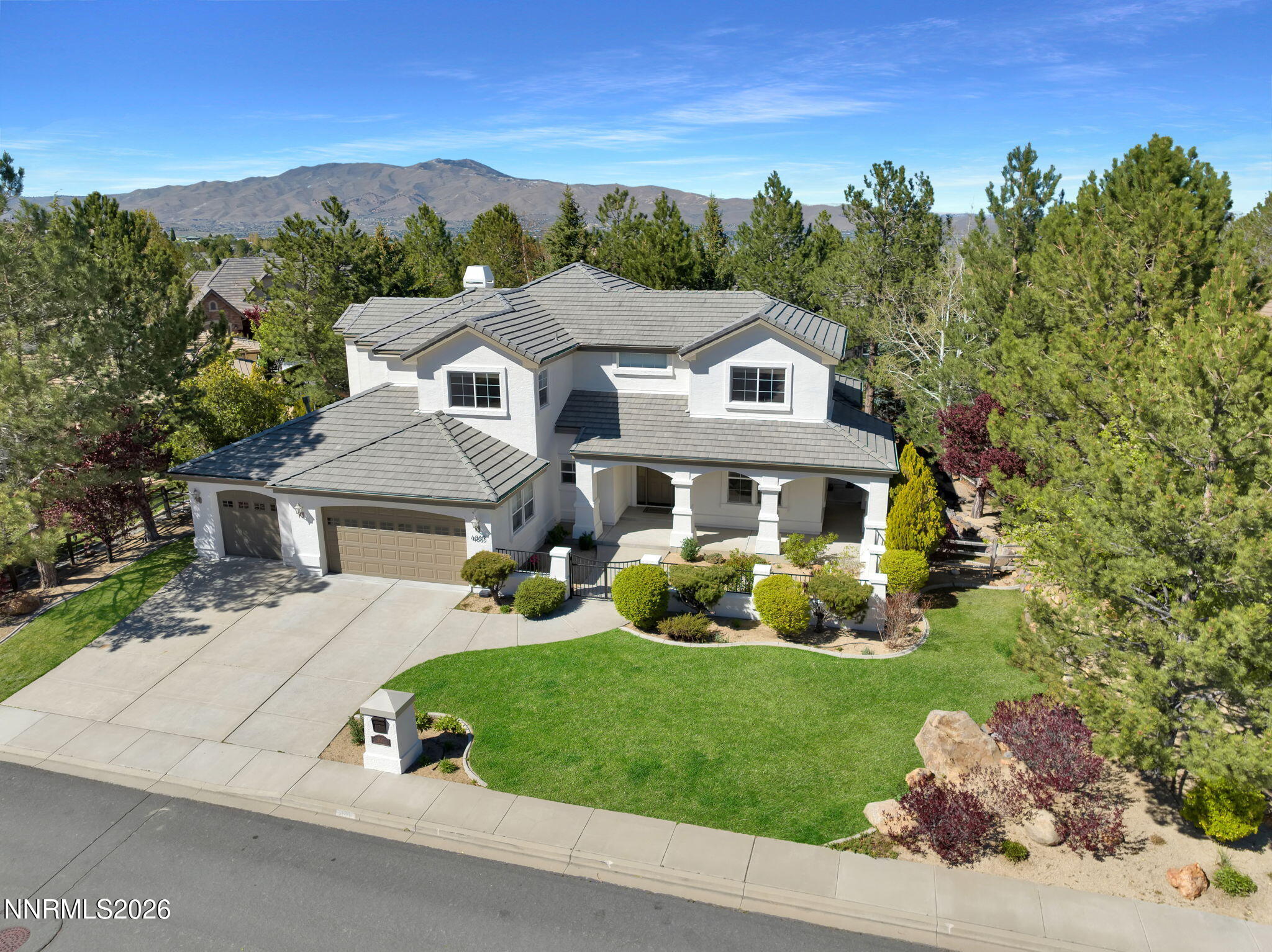 4885 Buckhaven Road Reno, NV 89519 - Photo 3 of 58 a front view of a house with garden