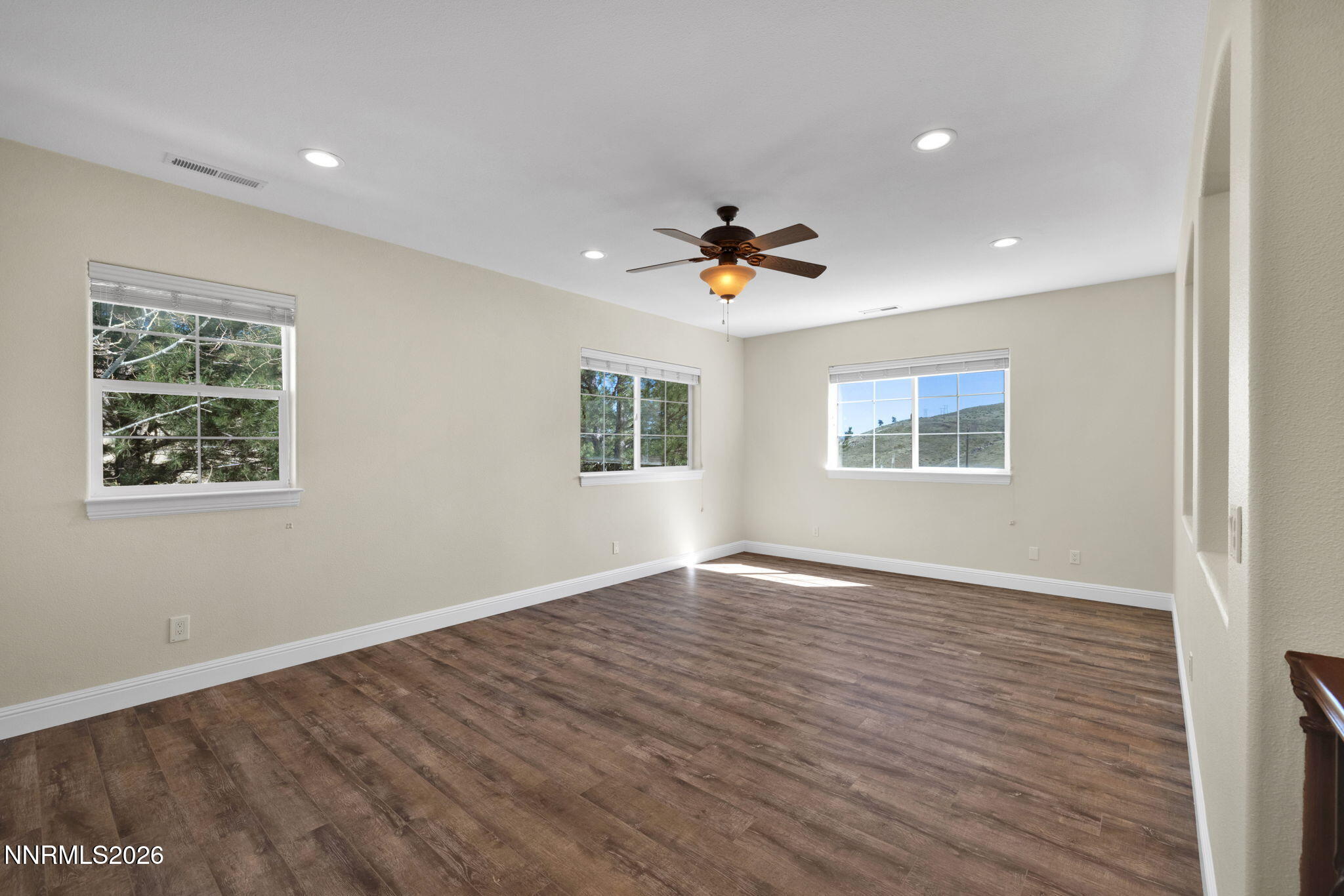 4885 Buckhaven Road Reno, NV 89519 - Photo 34 of 58 a view of an empty room with a window and wooden floor