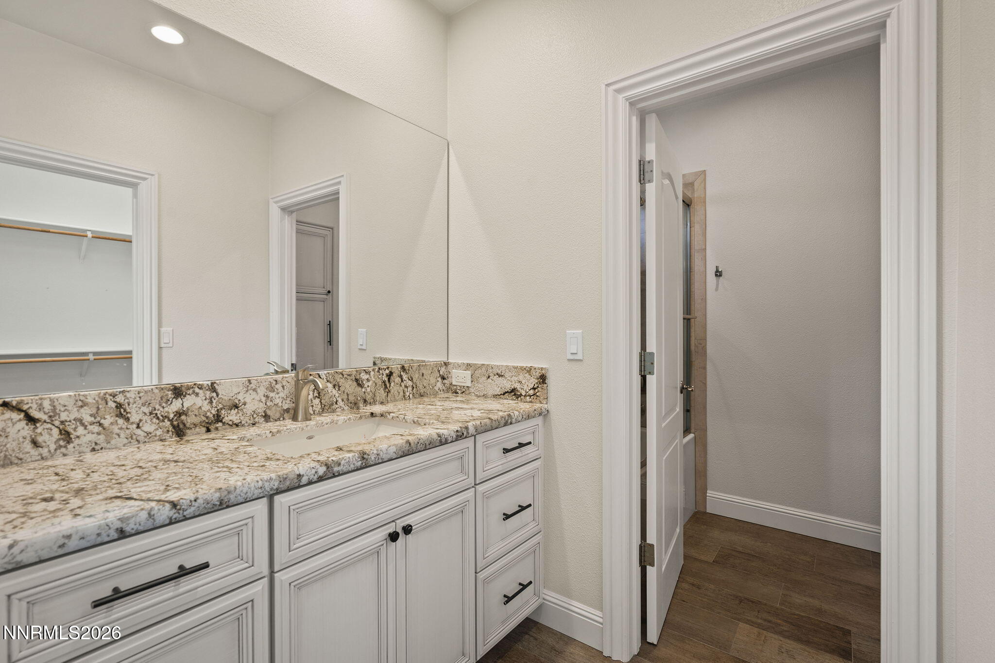 4885 Buckhaven Road Reno, NV 89519 - Photo 41 of 58 a bathroom with a granite countertop sink and a mirror