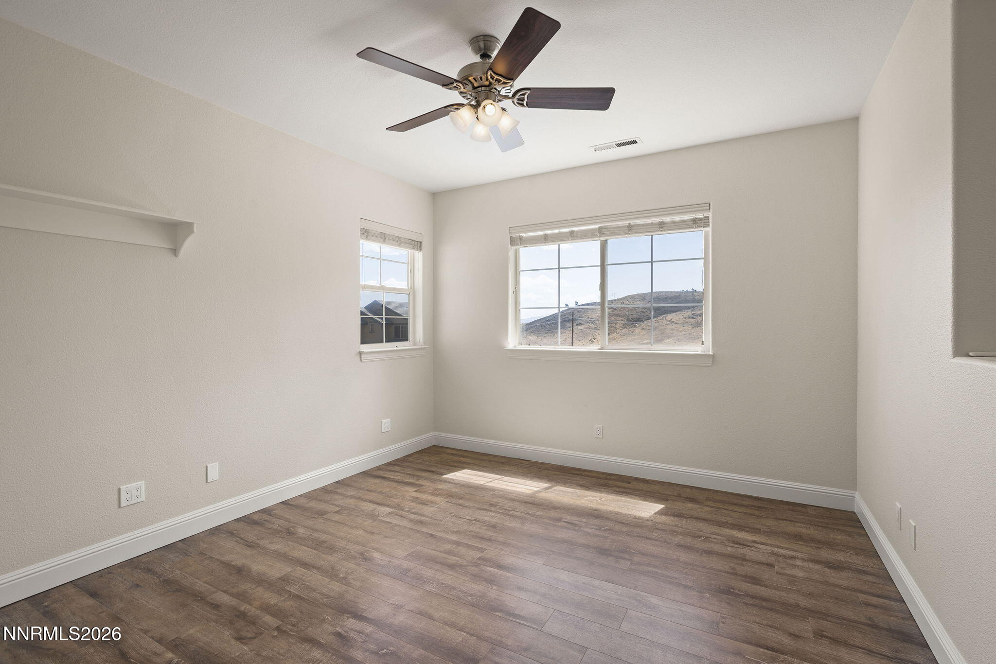 4885 Buckhaven Road Reno, NV 89519 - Photo 42 of 58 a view of empty room with wooden floor and fan