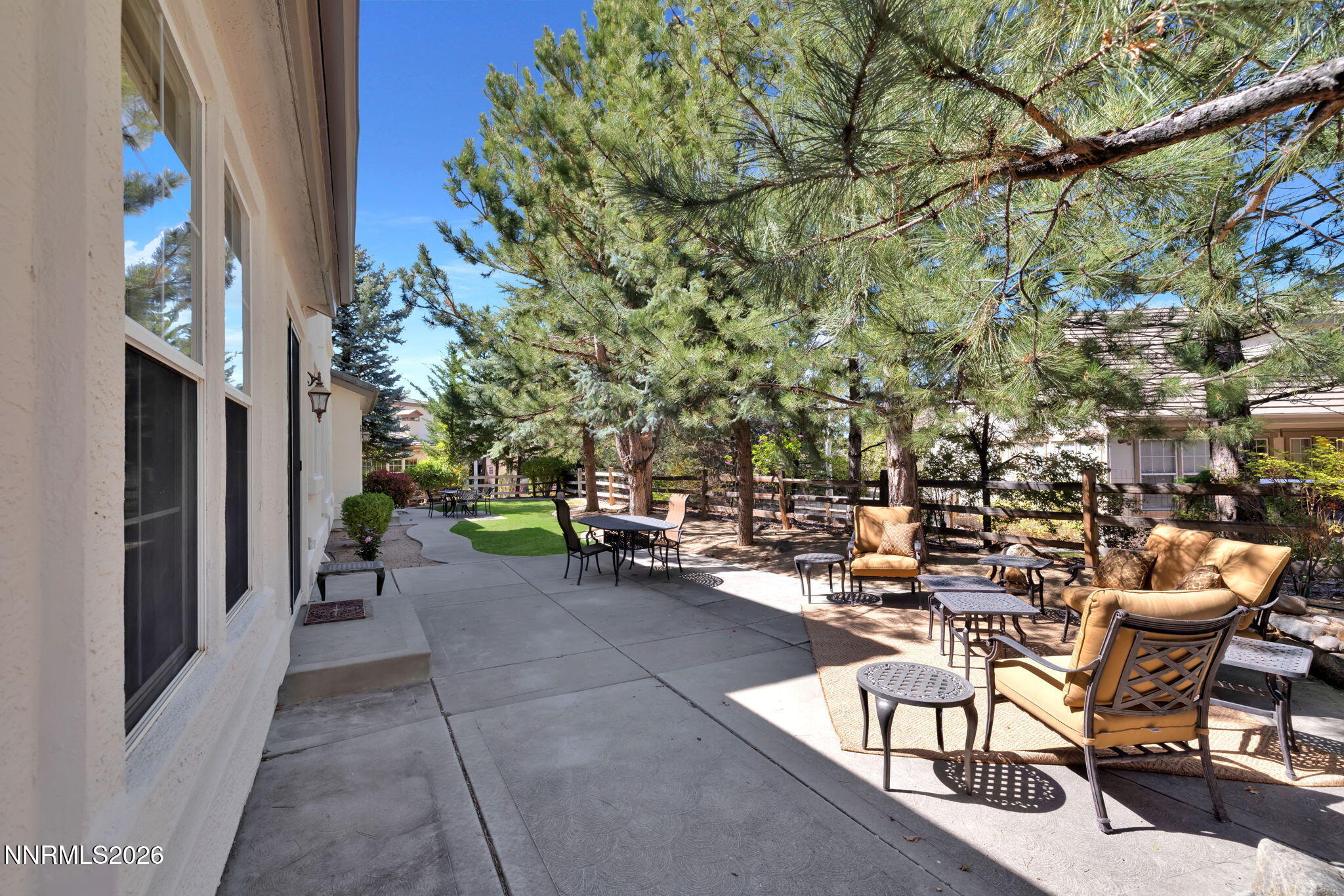 4885 Buckhaven Road Reno, NV 89519 - Photo 47 of 58 a view of a patio with a table and chairs and potted plants
