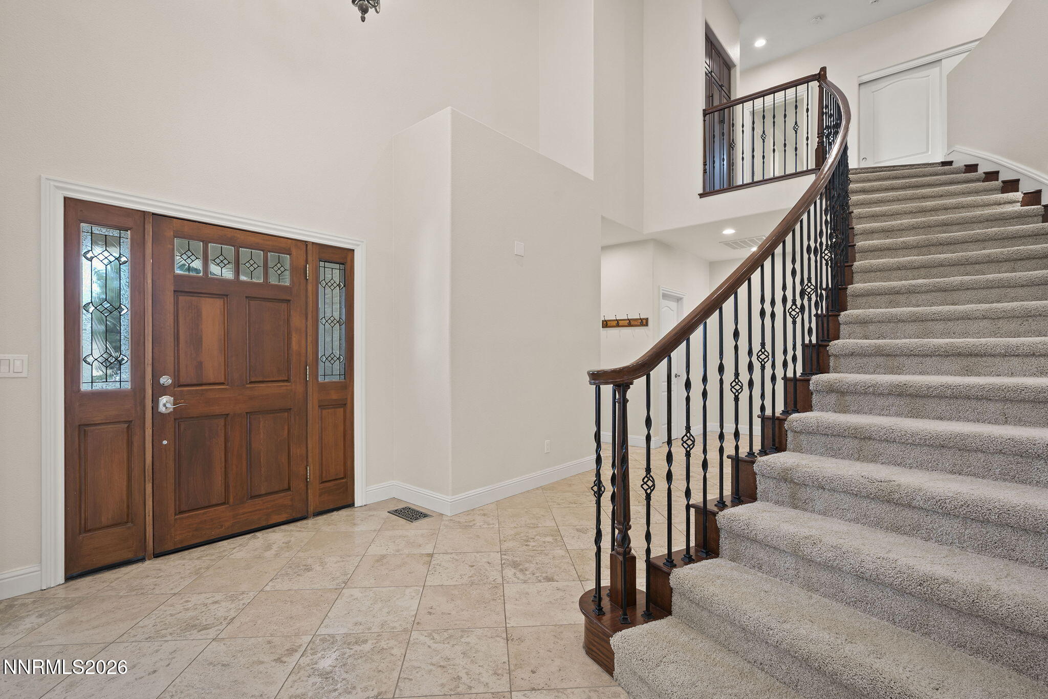 4885 Buckhaven Road Reno, NV 89519 - Photo 8 of 58 a view of staircase with lots of frames on wall