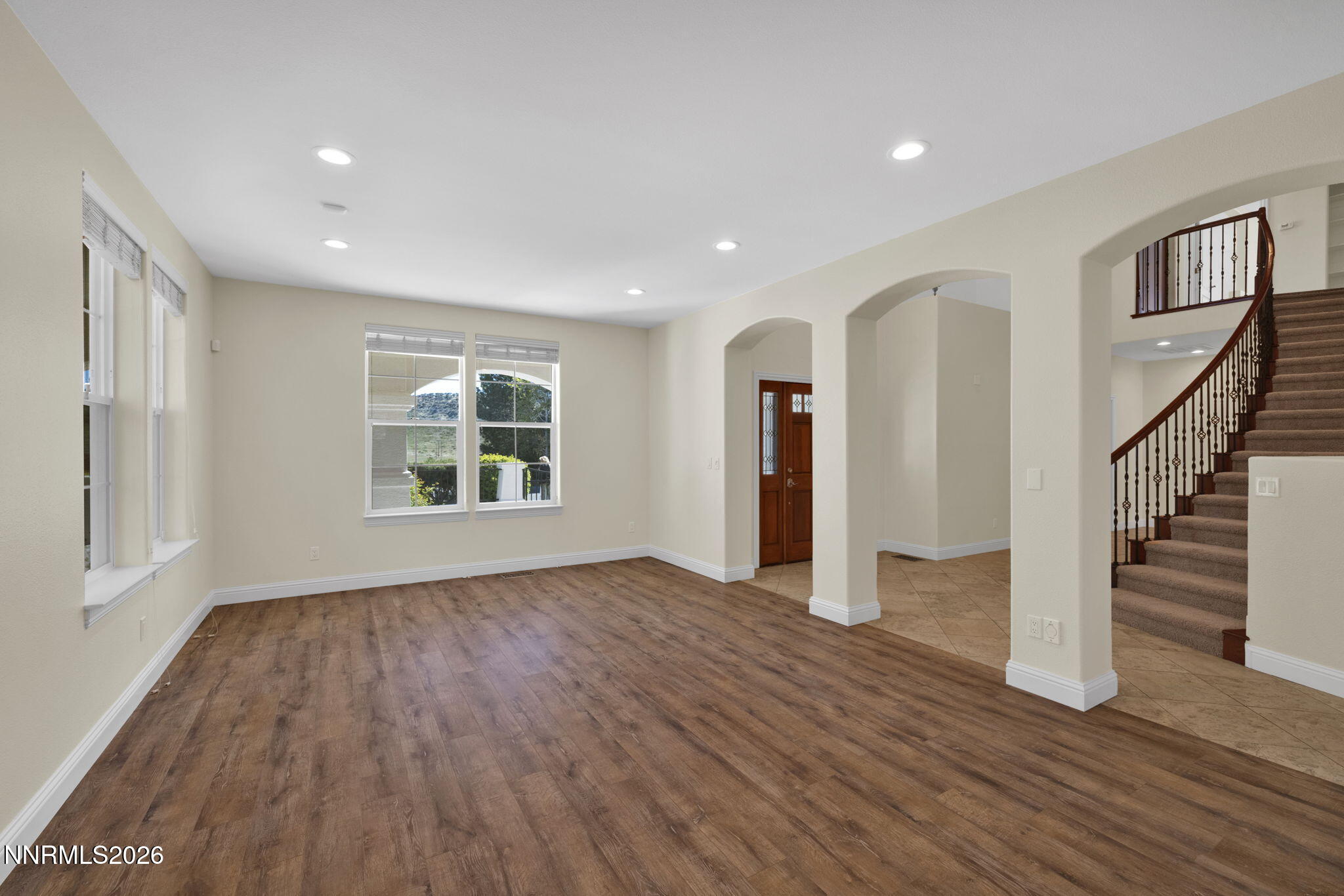 4885 Buckhaven Road Reno, NV 89519 - Photo 10 of 58 a view of an empty room with wooden floor and a window