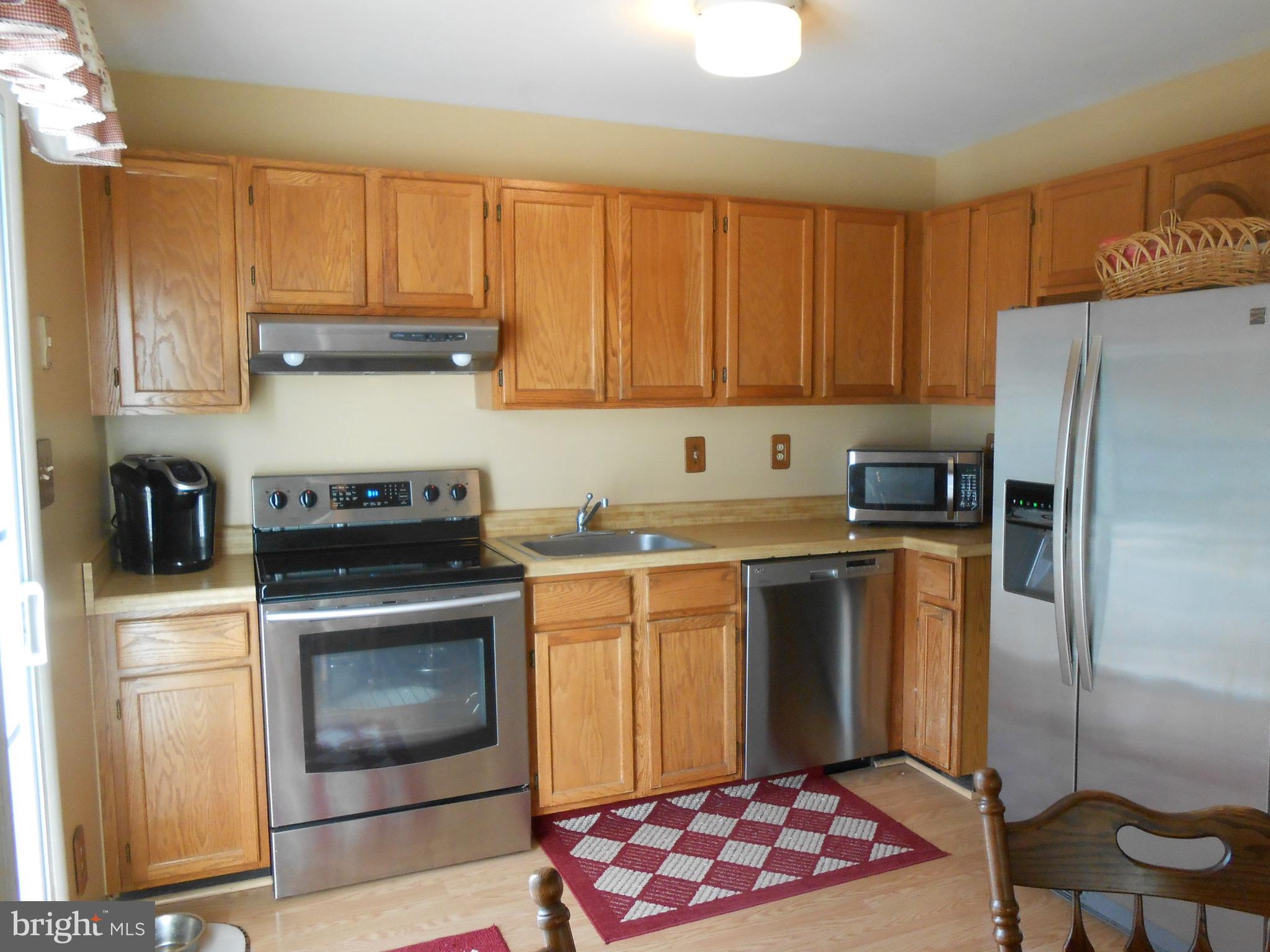 7121 Oliver Beach Road Baltimore, MD 21220 - Photo 4 of 25 KITCHEN WITH STAINLESS APPLIANCES