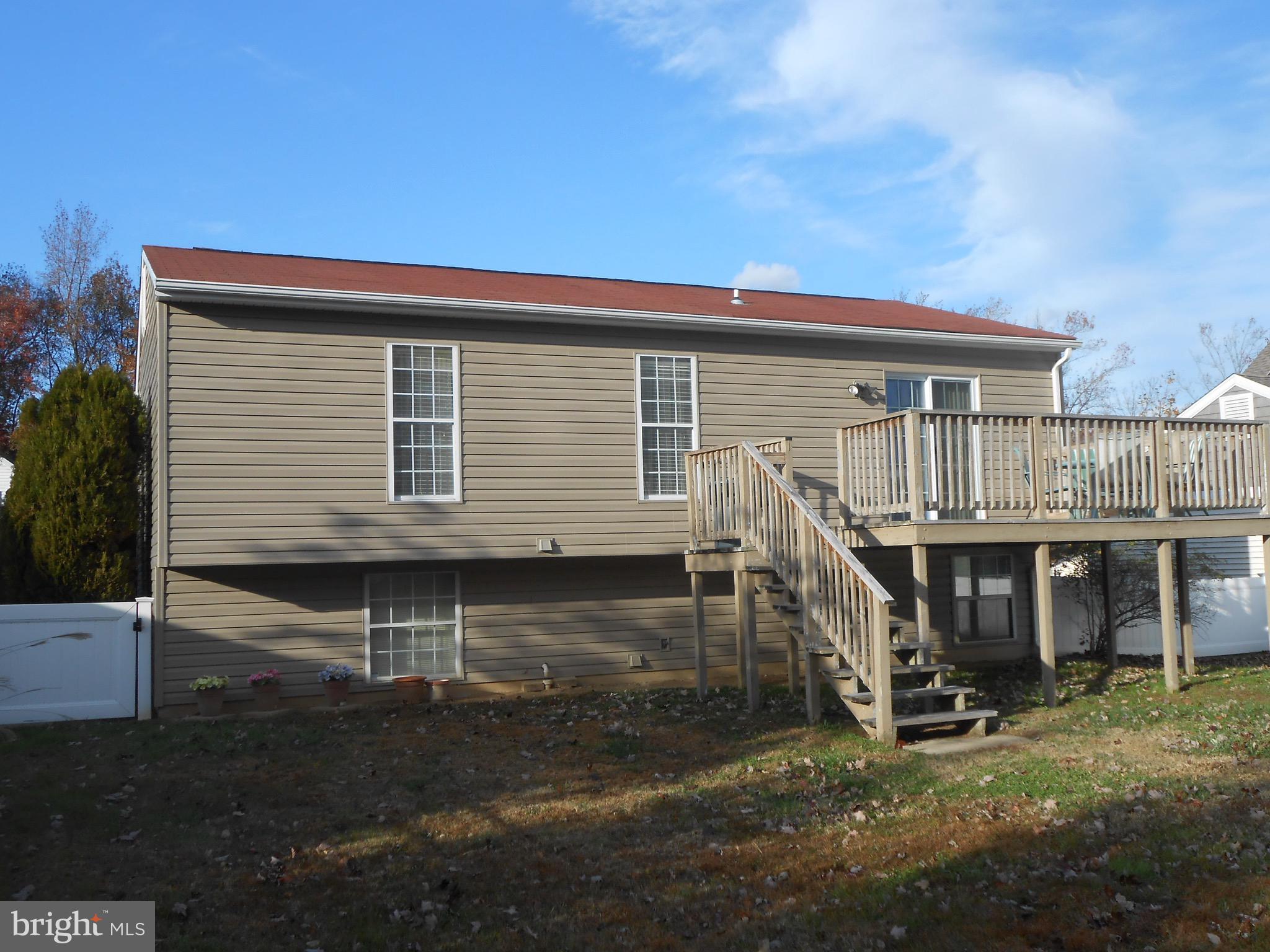 7121 Oliver Beach Road Baltimore, MD 21220 - Photo 8 of 25 DECK WITH STEPS DOWN TO FENCED YARD