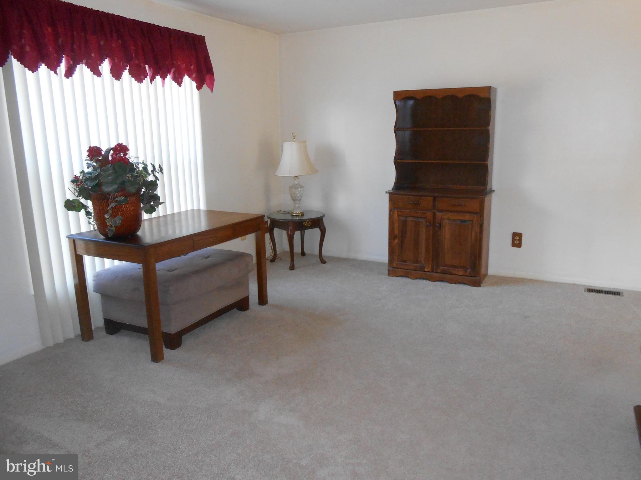 7121 Oliver Beach Road Baltimore, MD 21220 - Photo 10 of 25 LIVING ROOM WITH NEW WALL-TO-WALL CARPET