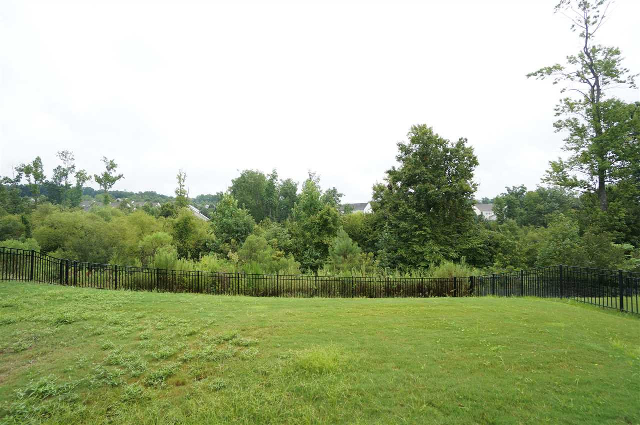7730 San Gabriel Street Raleigh, NC 27613 - Photo 22 of 25 Fenced back yard backs to tree lined lot for added privacy & scenic beauty. Back Yard