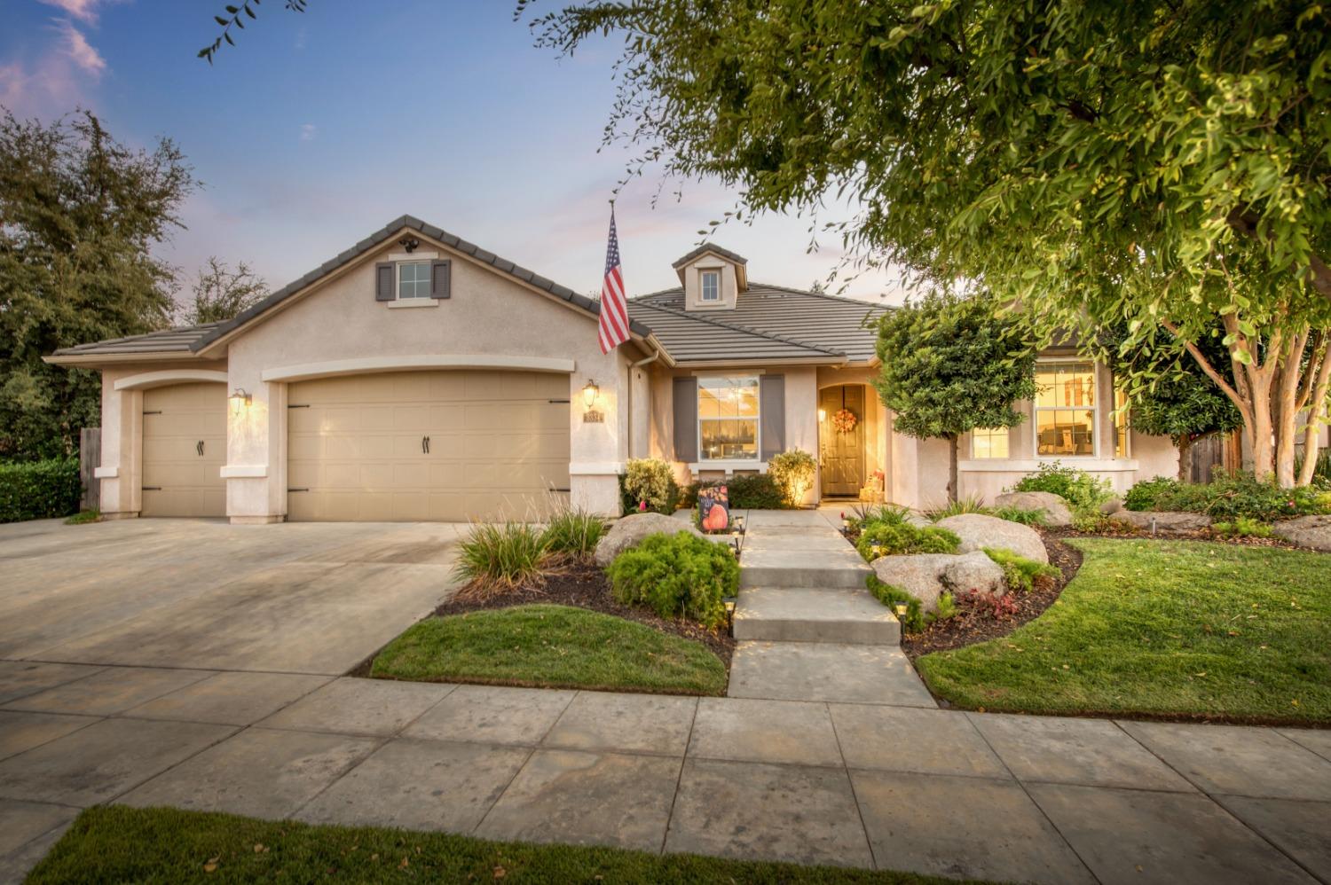 3334 Bellaire Avenue Clovis, CA 93619 - Photo 1 of 54 a front view of a house with garden