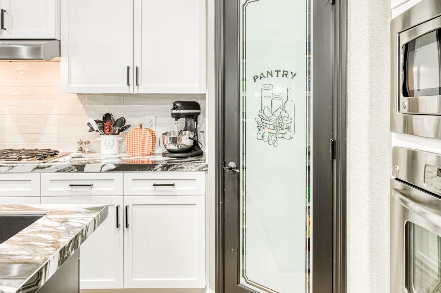 3334 Bellaire Avenue Clovis, CA 93619 - Photo 17 of 54 a kitchen with cabinets and a stove