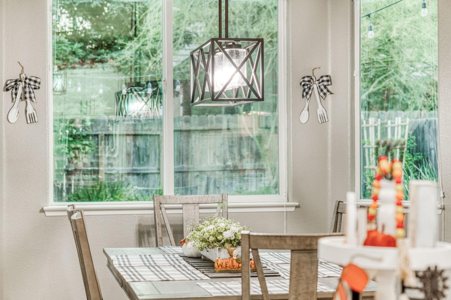 3334 Bellaire Avenue Clovis, CA 93619 - Photo 22 of 54 a view of a dining room with furniture window and outside view