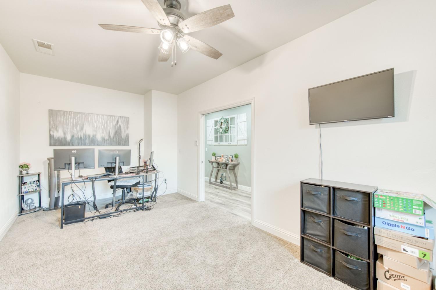 3334 Bellaire Avenue Clovis, CA 93619 - Photo 27 of 54 a living room with furniture a dining table and with a window
