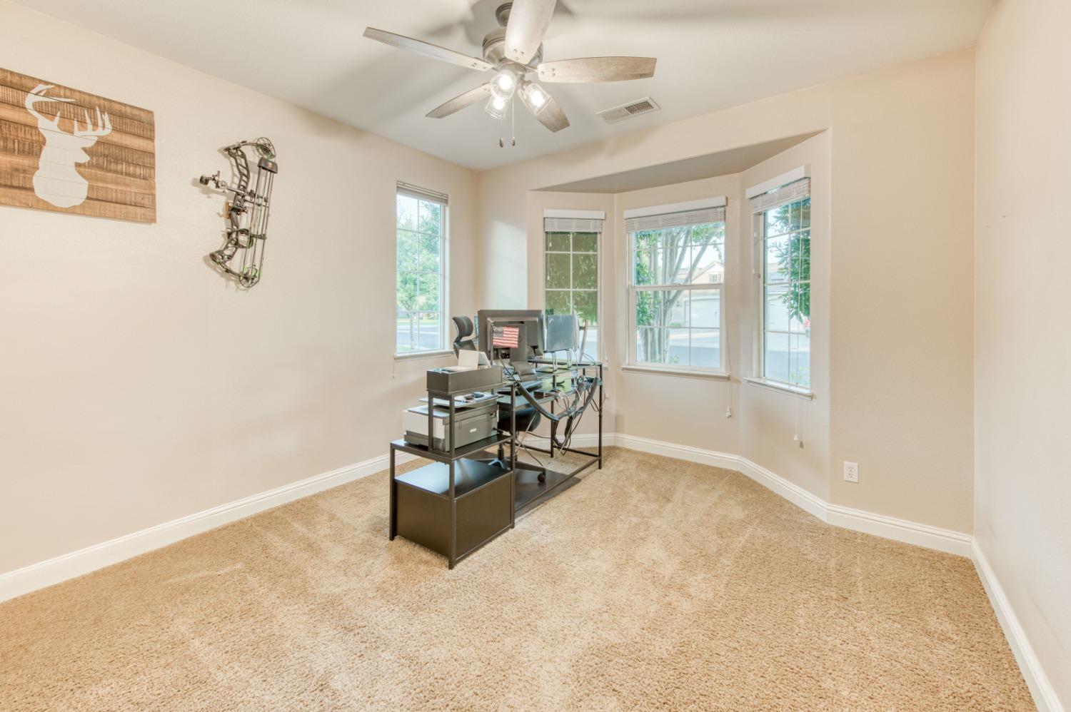 3334 Bellaire Avenue Clovis, CA 93619 - Photo 29 of 54 a living room with furniture and a large window