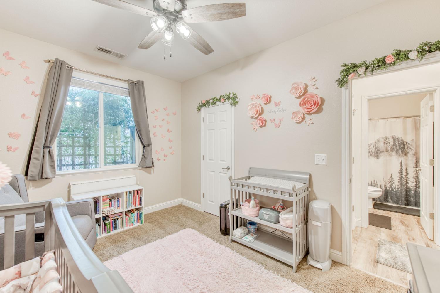 3334 Bellaire Avenue Clovis, CA 93619 - Photo 31 of 54 a bedroom with furniture and a large window