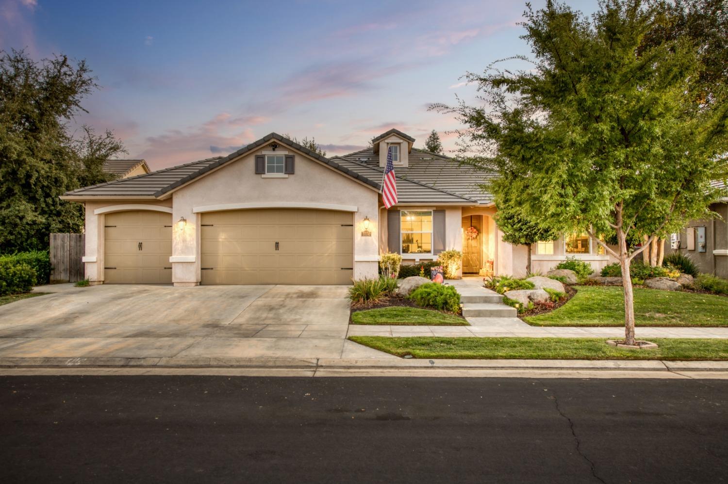 3334 Bellaire Avenue Clovis, CA 93619 - Photo 44 of 54 a front view of a house with a yard