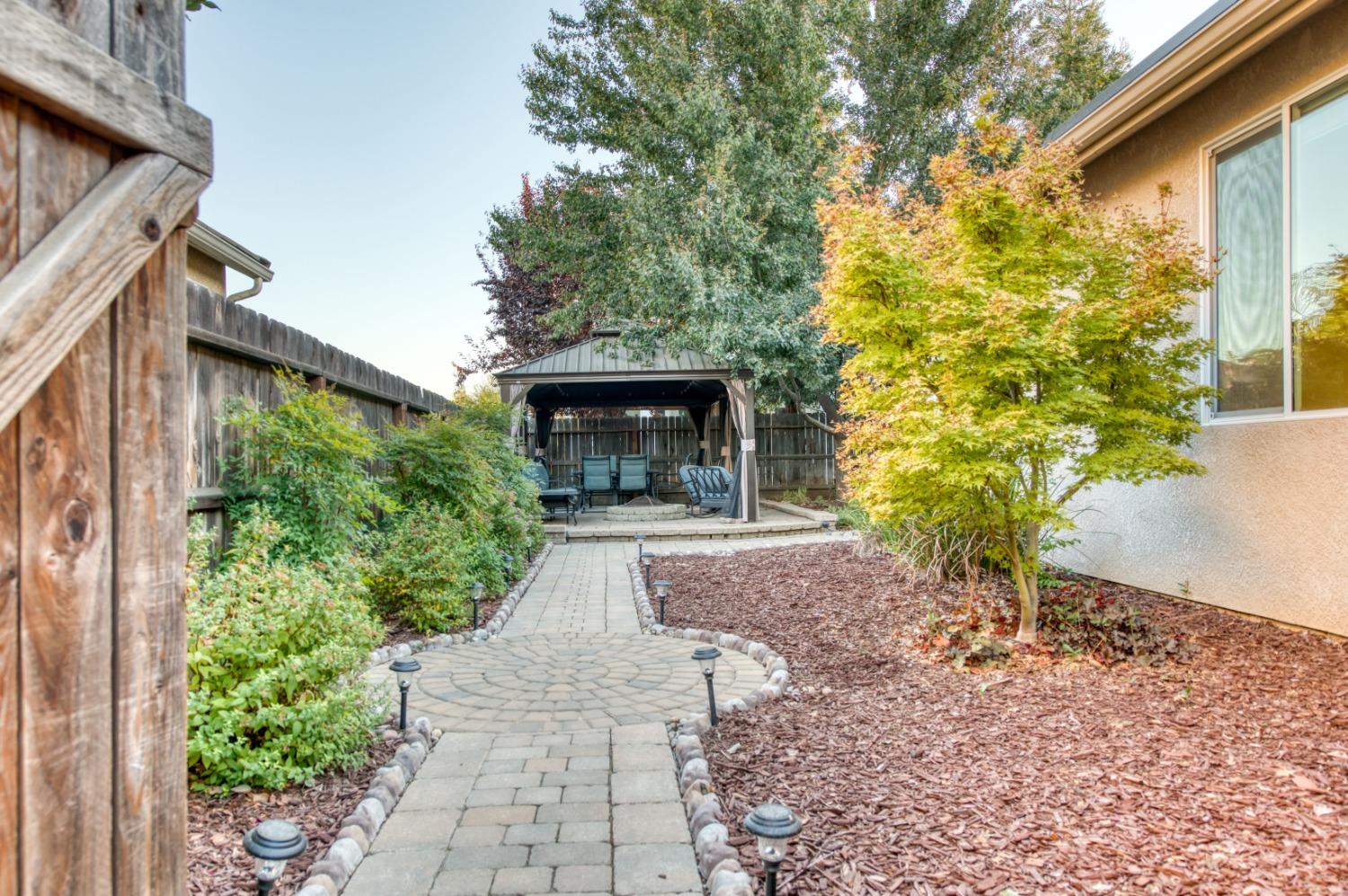 3334 Bellaire Avenue Clovis, CA 93619 - Photo 48 of 54 front view of a house with a yard and potted plants