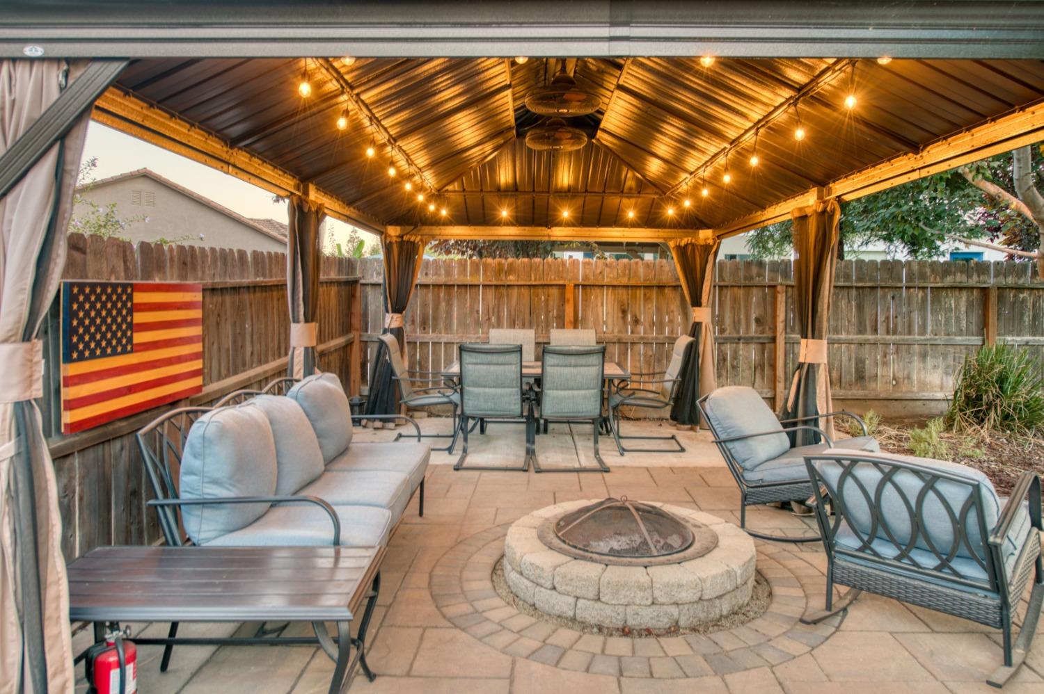 3334 Bellaire Avenue Clovis, CA 93619 - Photo 5 of 54 a dining room with furniture and a floor to ceiling window