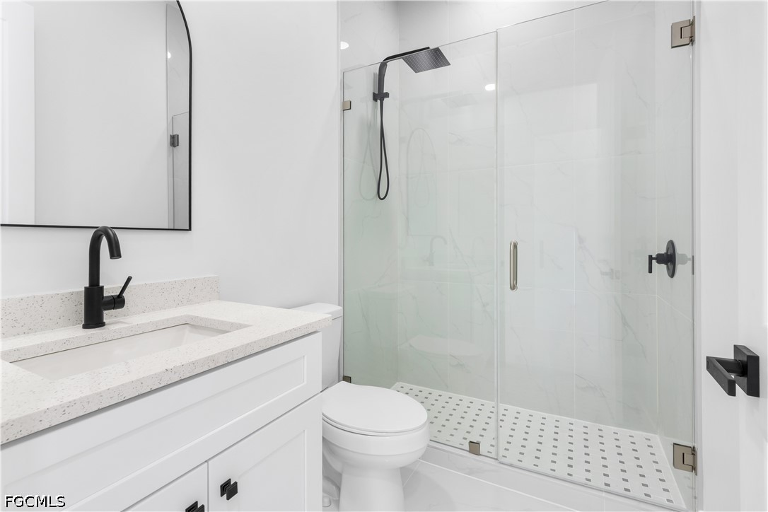 3004 South Tulip Road LaBelle, FL 33935 - Photo 21 of 24 a bathroom with a sink toilet and shower