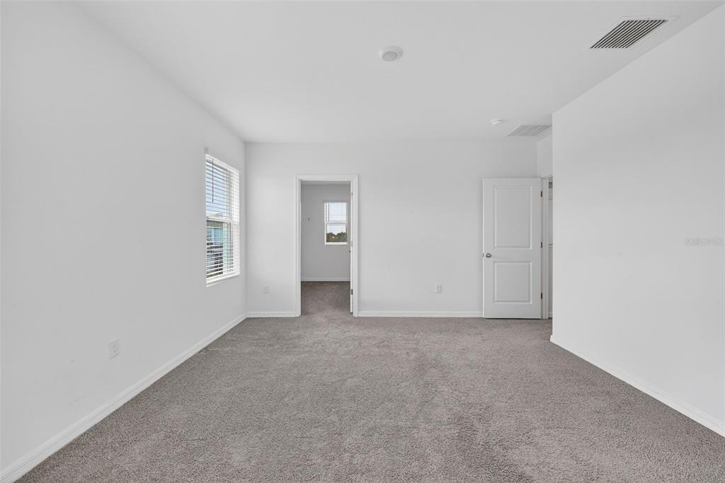 3842 Sunny Spring Street Plant City, FL 33565 - Photo 12 of 46 an empty room with windows