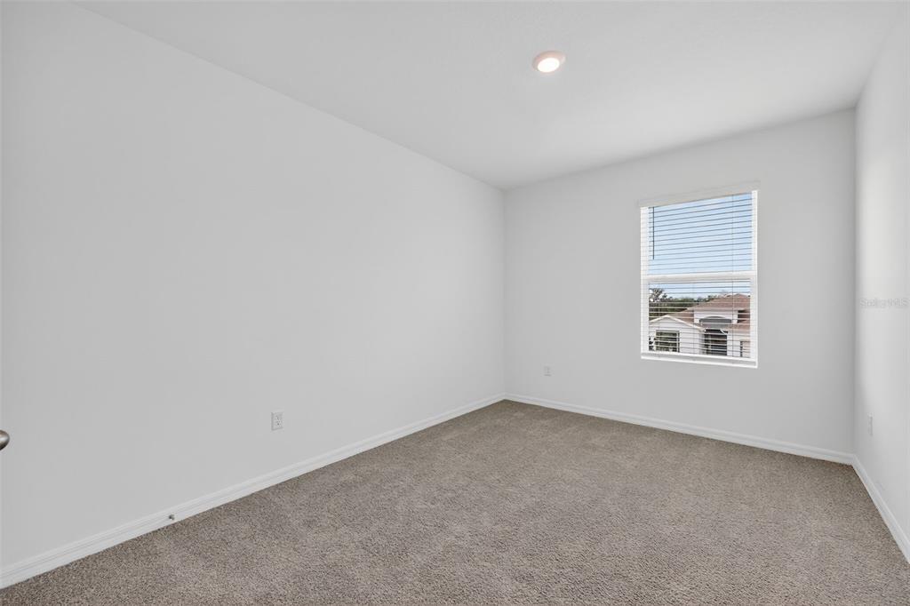 3842 Sunny Spring Street Plant City, FL 33565 - Photo 16 of 46 an empty room with a window