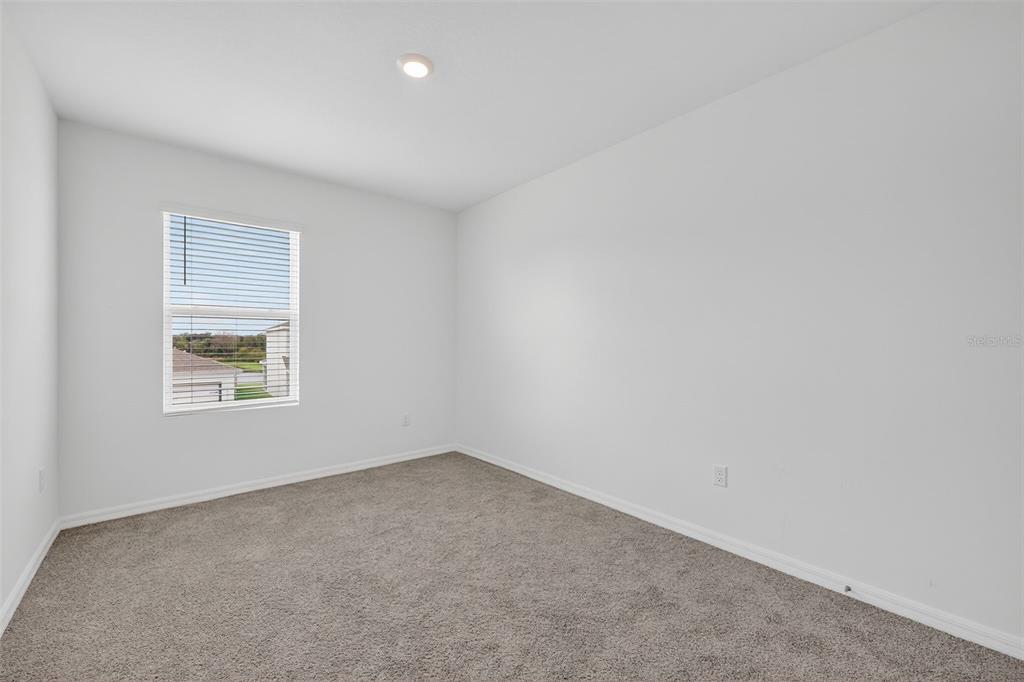 3842 Sunny Spring Street Plant City, FL 33565 - Photo 18 of 46 an empty room with a window
