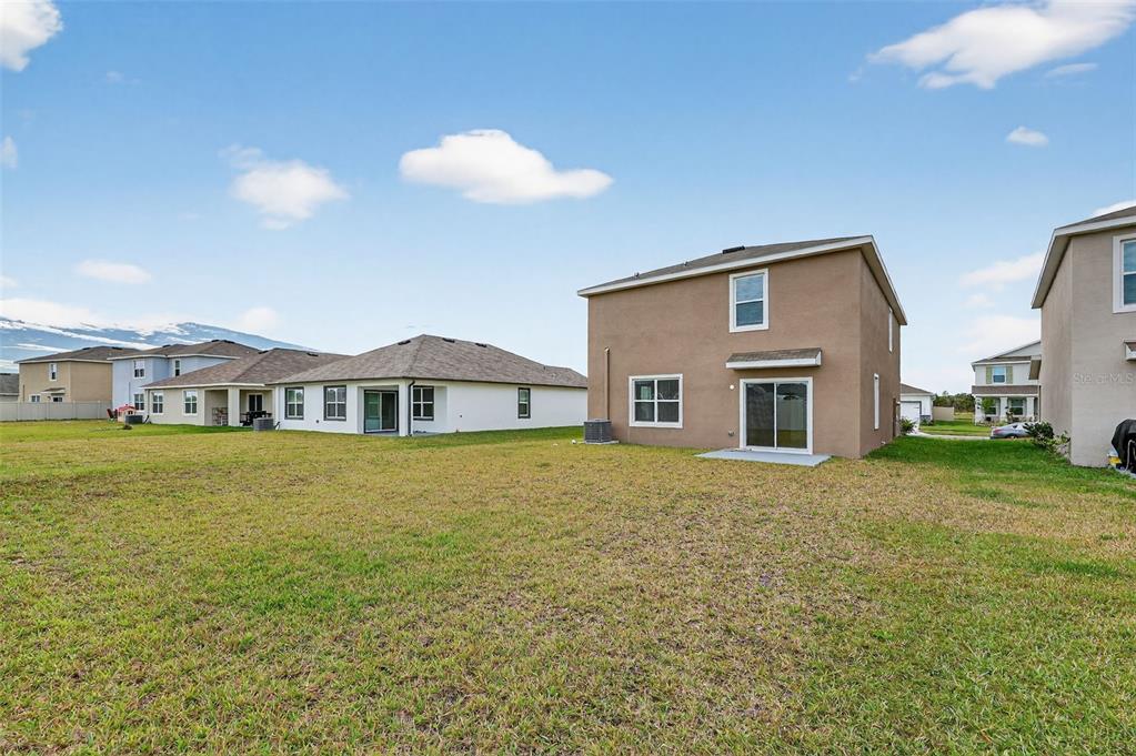 3842 Sunny Spring Street Plant City, FL 33565 - Photo 28 of 46 a front view of a house with a garden