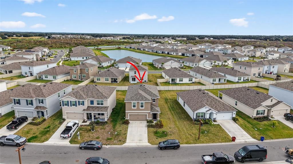 3842 Sunny Spring Street Plant City, FL 33565 - Photo 31 of 46 an aerial view of residential houses with outdoor space