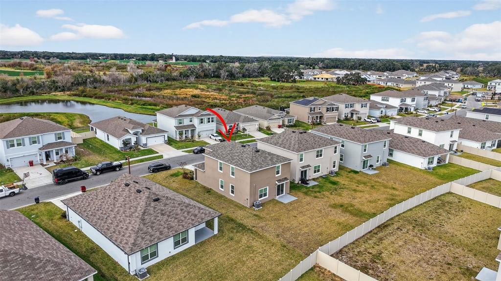3842 Sunny Spring Street Plant City, FL 33565 - Photo 33 of 46 an aerial view of residential houses with outdoor space and ocean view