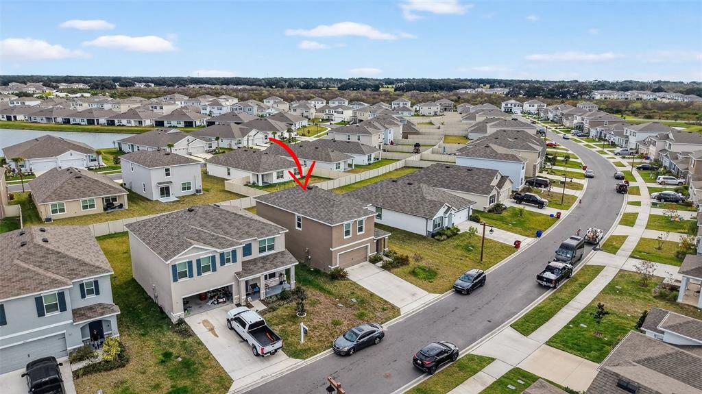 3842 Sunny Spring Street Plant City, FL 33565 - Photo 36 of 46 an aerial view of residential houses with outdoor space