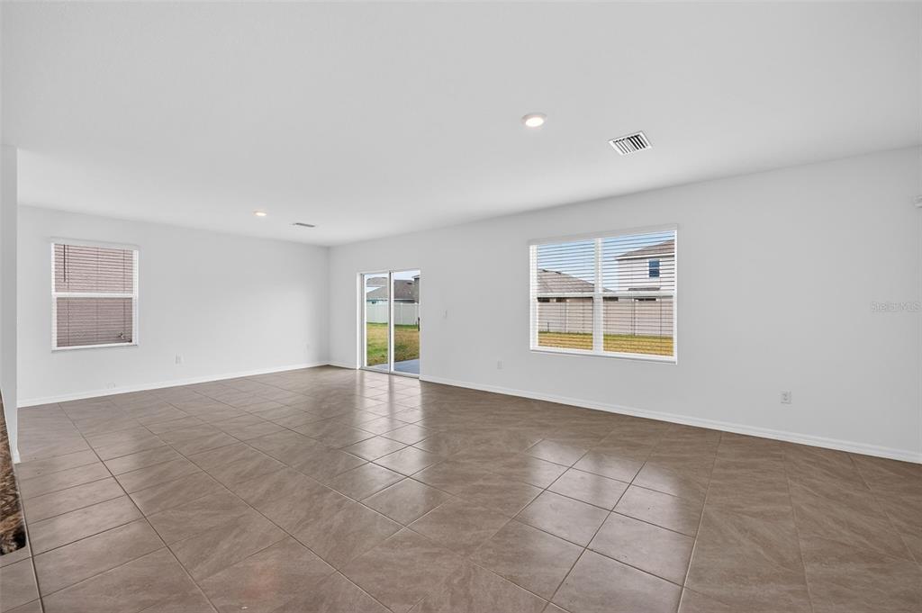 3842 Sunny Spring Street Plant City, FL 33565 - Photo 5 of 46 a view of an empty room with a window