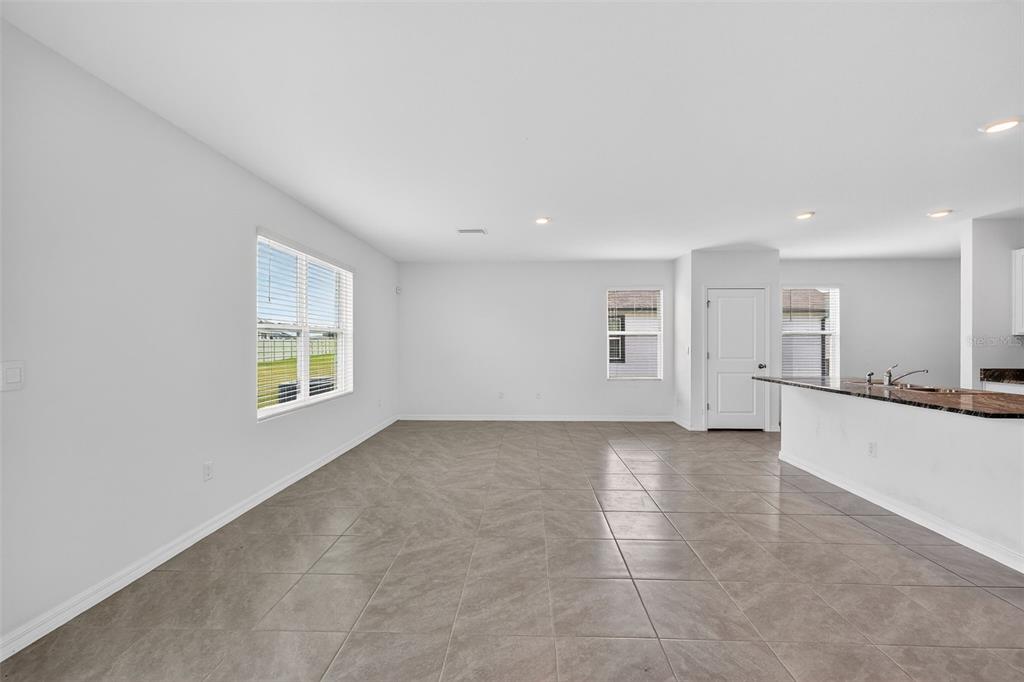 3842 Sunny Spring Street Plant City, FL 33565 - Photo 8 of 46 a view of an empty room with a window