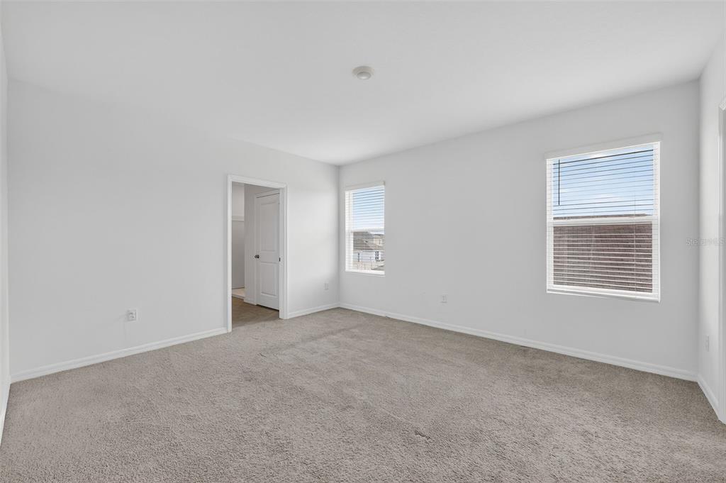 3842 Sunny Spring Street Plant City, FL 33565 - Photo 10 of 46 a view of an empty room with a window