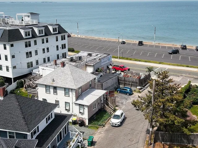 a view of a house with pool and chairs