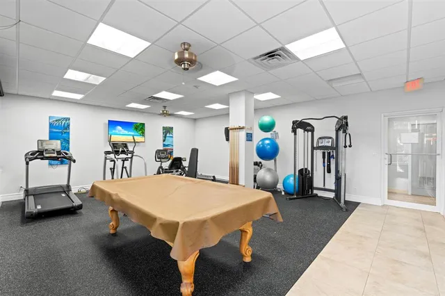 a view of swimming pool with outdoor seating and plants