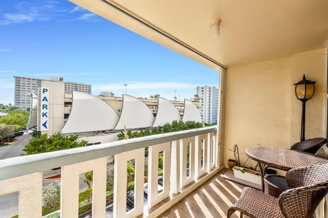 a view of a balcony with furniture