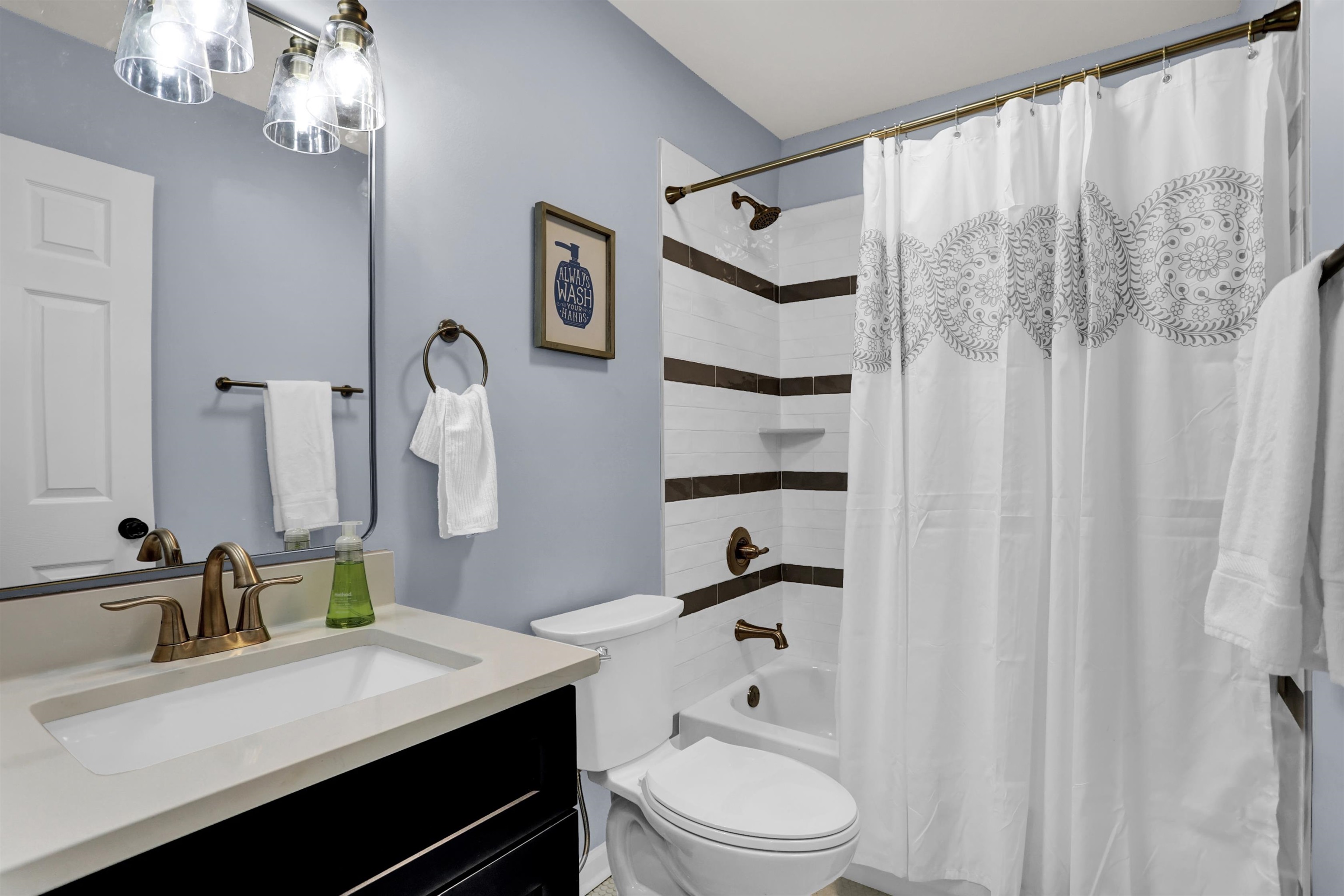 245 West Edwin Circle Memphis, TN 38104 - Photo 17 of 39 a bathroom with a sink a toilet and a mirror