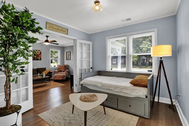 a bedroom with furniture and a window