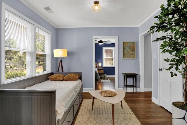 a bedroom with a bed and a table